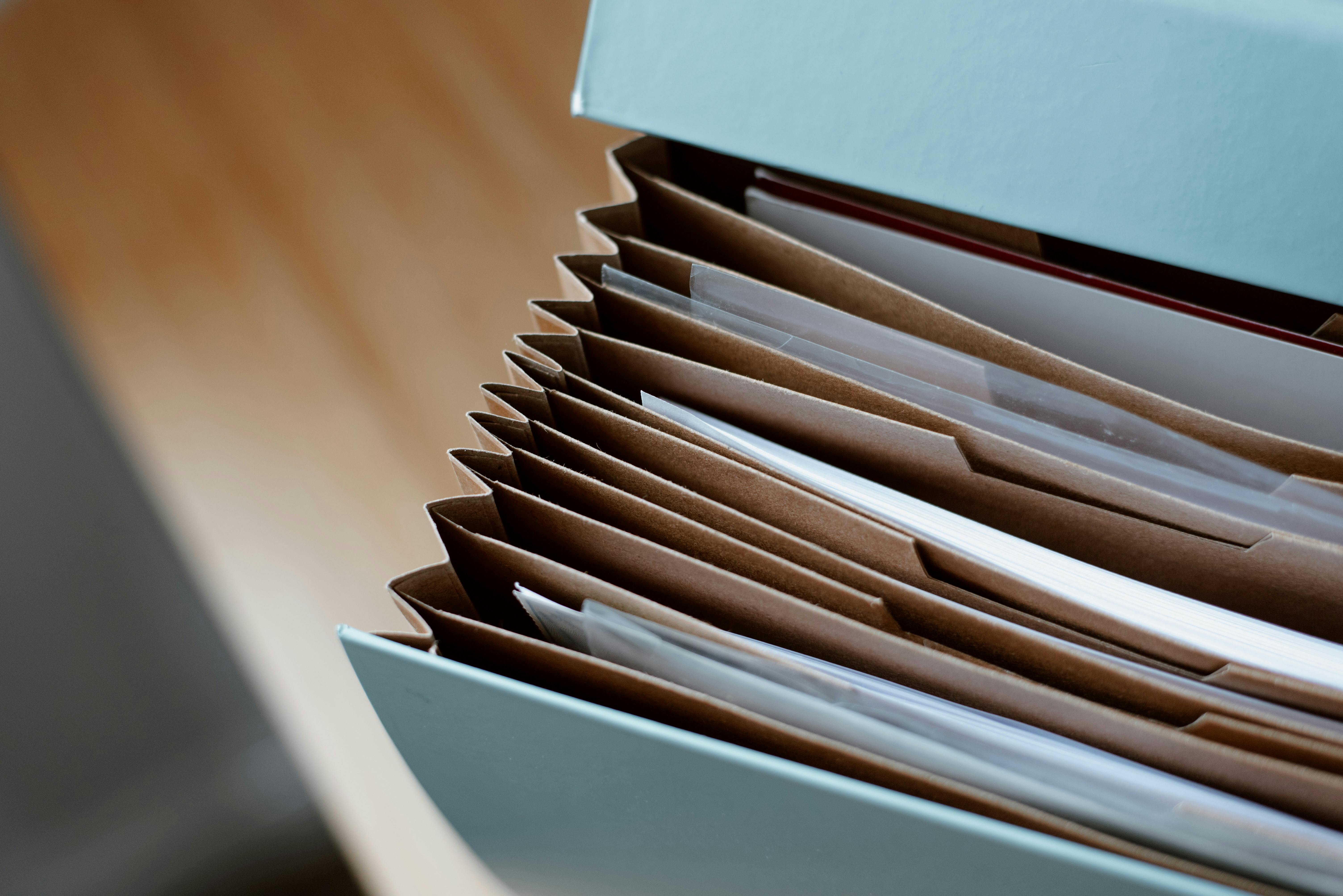 A file folder filled with files.